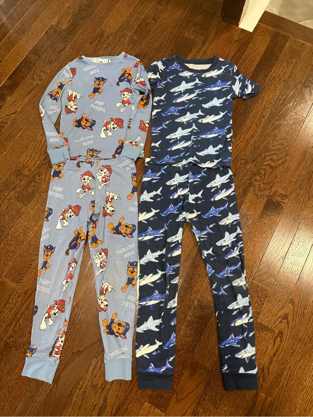 H&M Light Blue Paw Patrol & Member’s Mark Navy Shark Kids One-Piece Pajama Sets